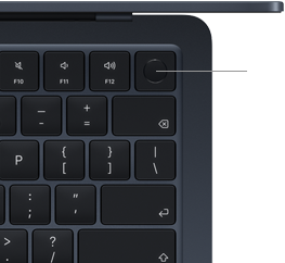 Gros plan sur le bouton Touch ID situé dans le coin supérieur droit du clavier d’un MacBook Air, avec un trait désignant l’icône Touch ID, pour montrer qu’il est possible d’appuyer sur le bouton pour déverrouiller l’appareil en toute sécurité