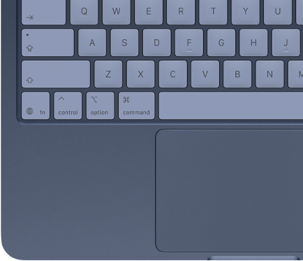 Vue de haut d’un MacBook Neo couleur indigo, avec touches assorties et trackpad Multi-Touch visible